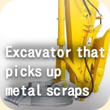 Excavator that picks up metal scraps