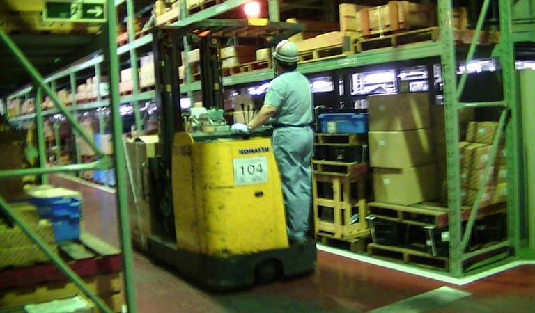 Forklift that is operated standing up (Reach fork)