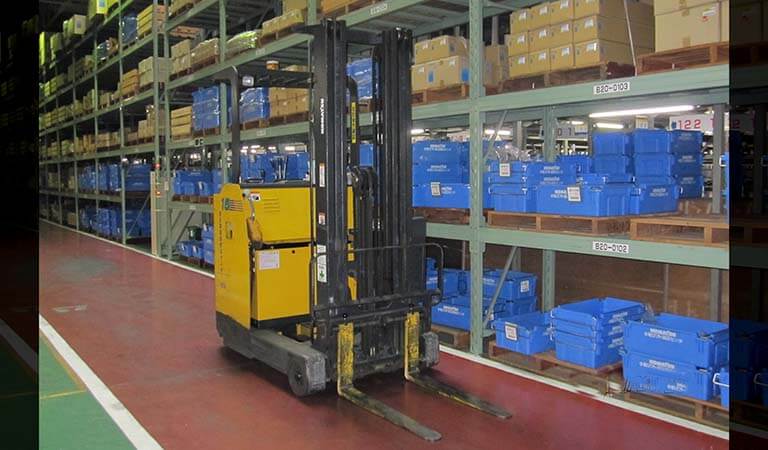 Forklift that is operated standing up (Reach fork)