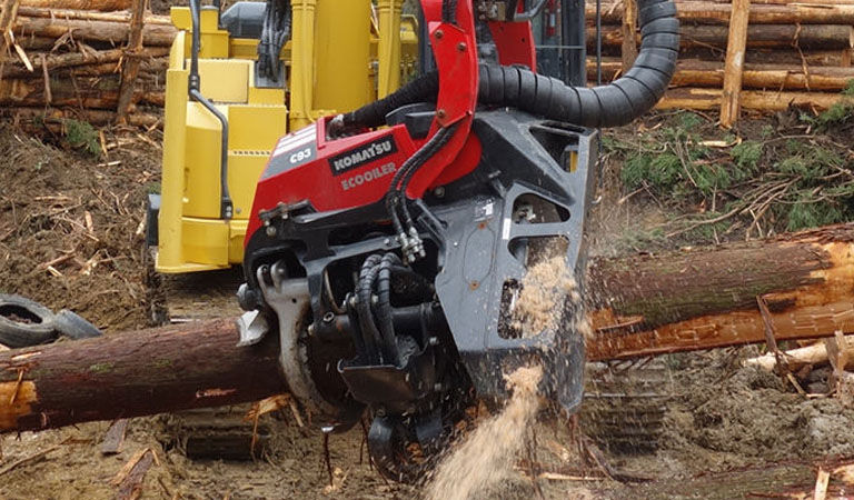 Excavator that cuts trees in the forest