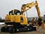 Excavator that demolishes buildings