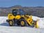 Wheel loader which removes snow