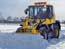 Wheel loader which removes snow